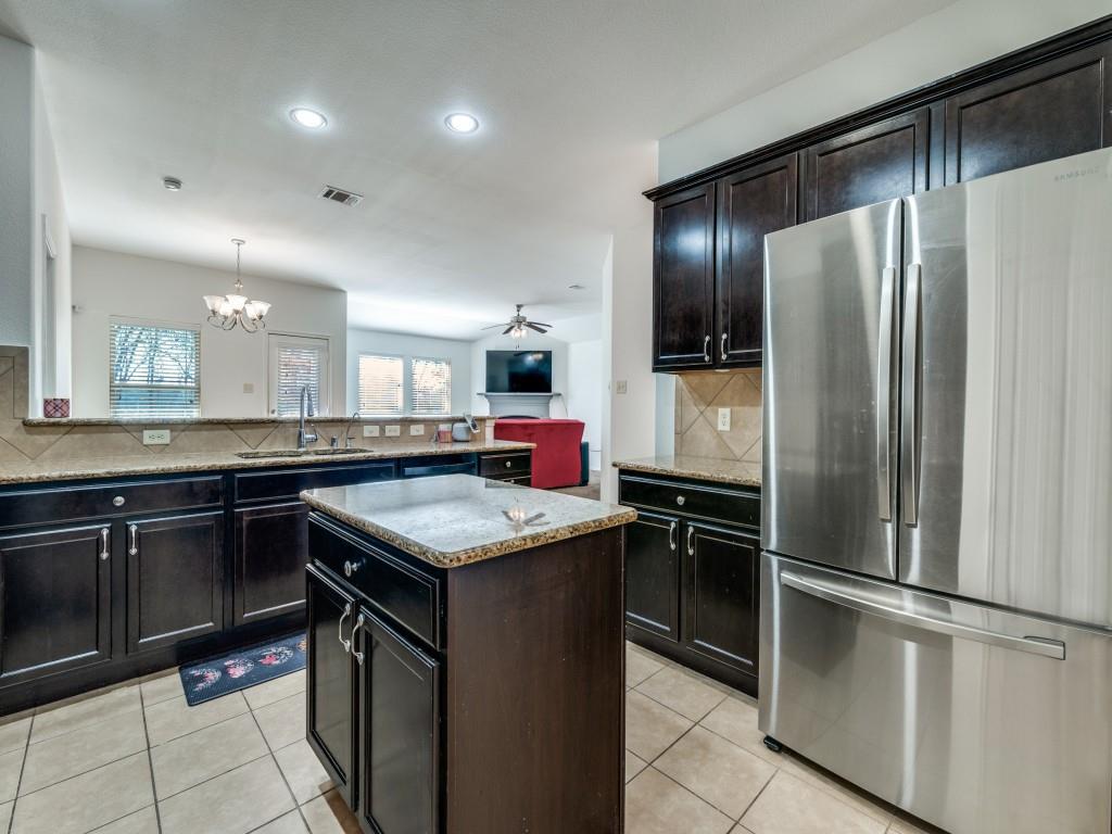 2313 Luscombe Lane Anna, TX 75409 - Photo 8 of 30 a kitchen with stainless steel appliances granite countertop a refrigerator and a sink