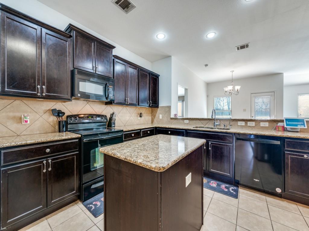 2313 Luscombe Lane Anna, TX 75409 - Photo 9 of 30 a kitchen with a sink stove and microwave