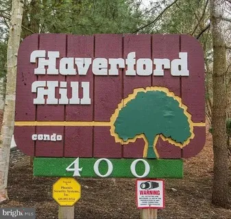 a view of a table and chairs in front of building