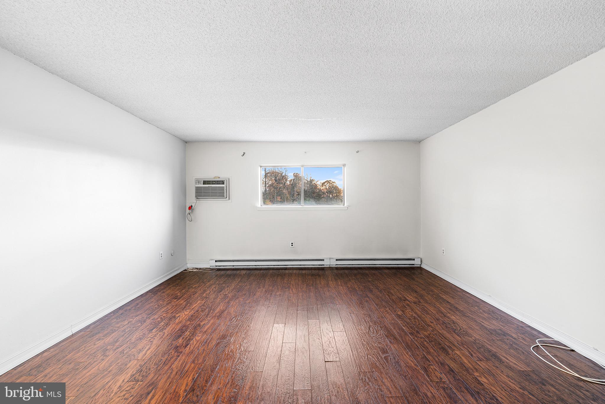 400 Glendale Road, Unit K52 Havertown, PA 19083 - Photo 5 of 18 an empty room with wooden floor and windows