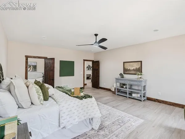 a bedroom with a bed and a chair