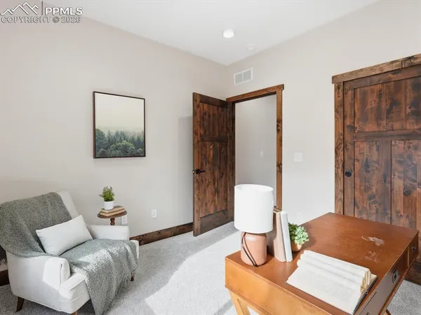 a living room with furniture and window