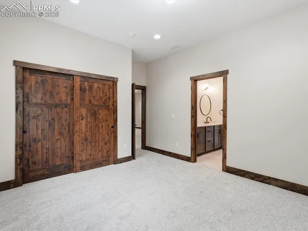 a view of an empty room with entrance and door