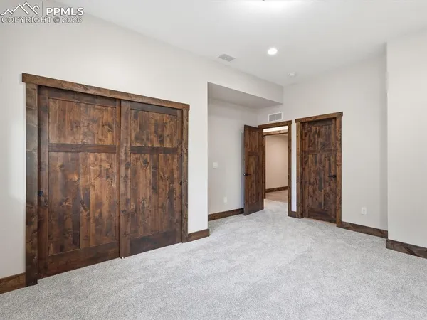 an empty room with closet area