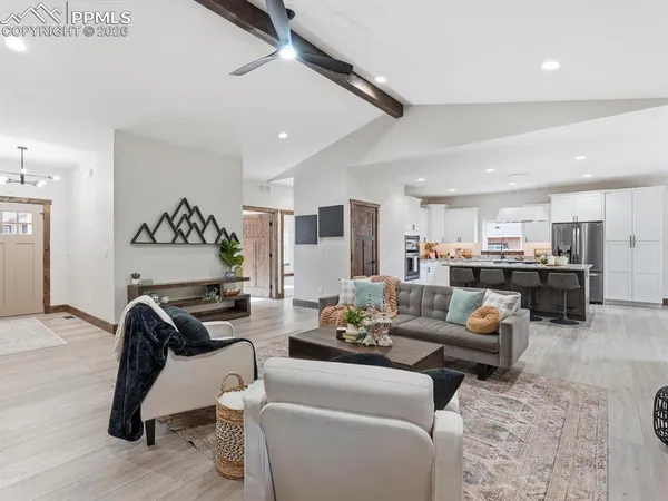 a living room with furniture or kitchen view and a couch