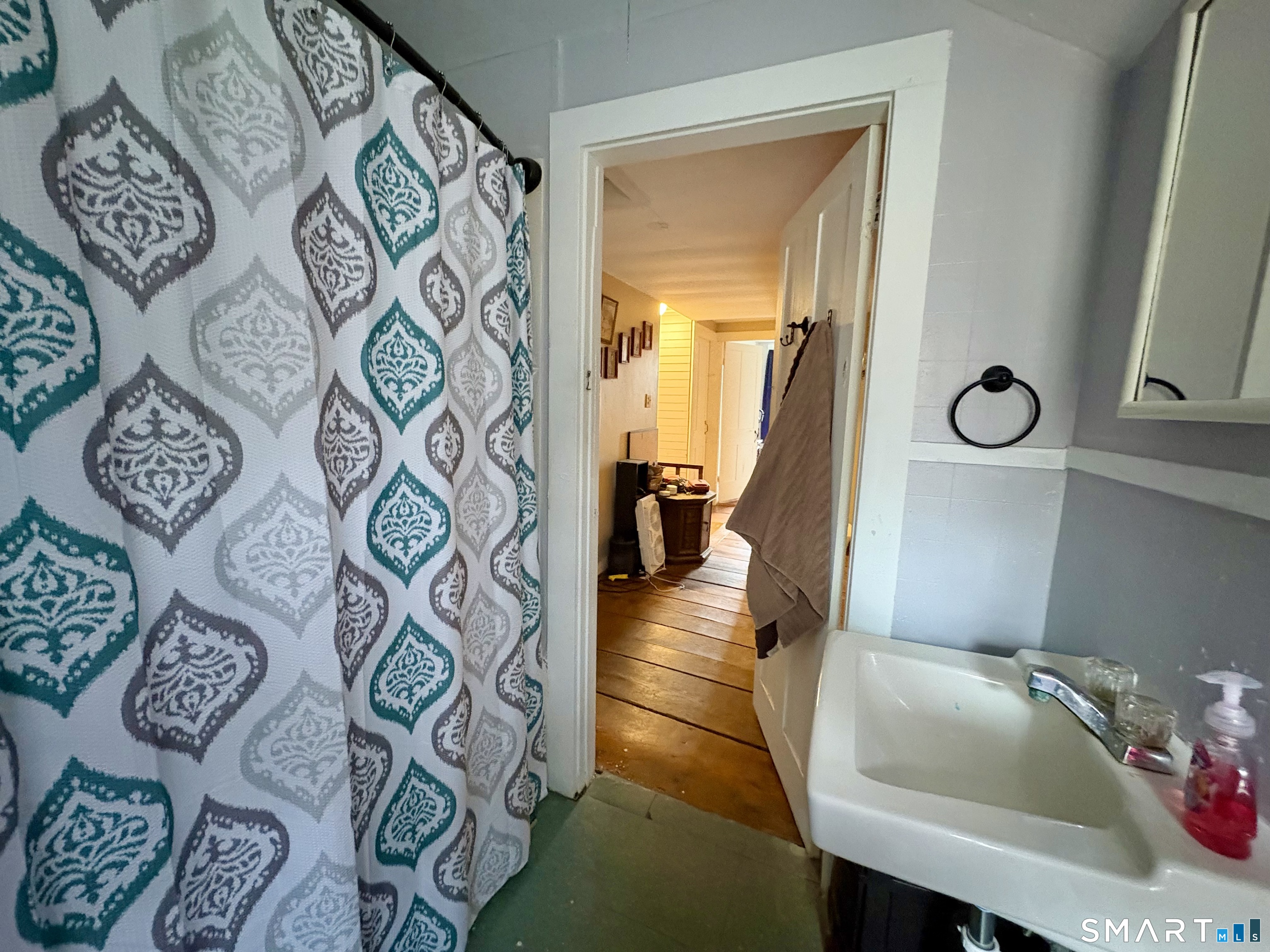 279 River Road Putnam, CT 06260 - Photo 16 of 18 a bathroom with a sink and a mirror