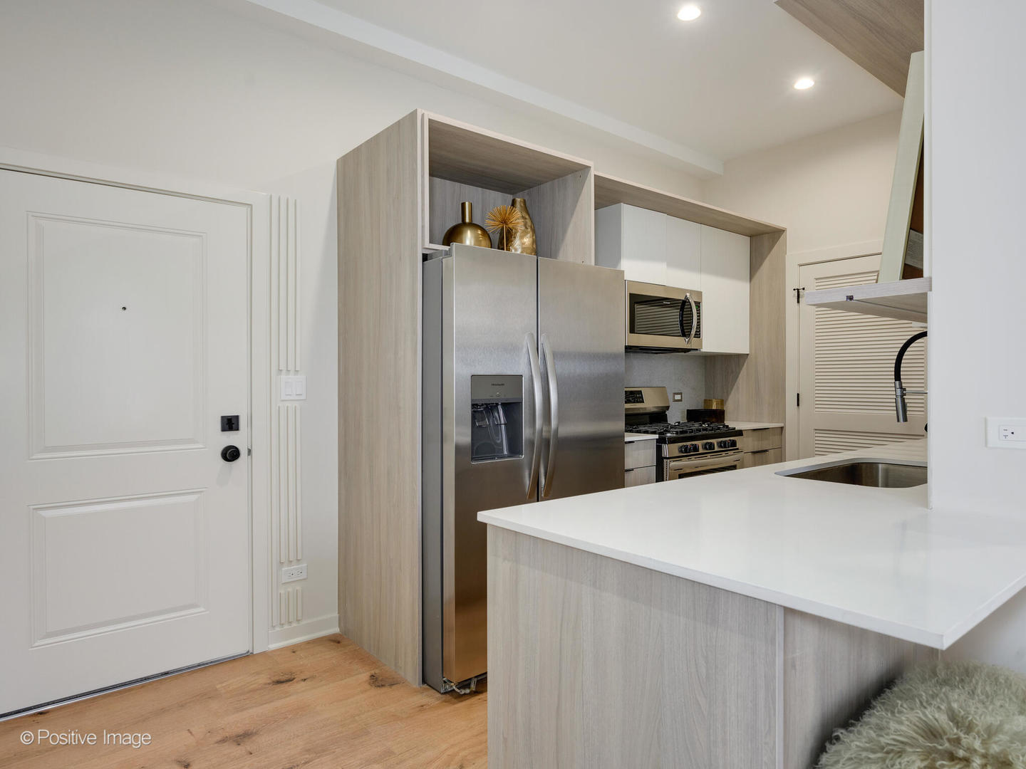 2801 Thatcher Avenue, Unit 303 River Grove, IL 60171 - Photo 2 of 33 a kitchen with stainless steel appliances a refrigerator and a sink