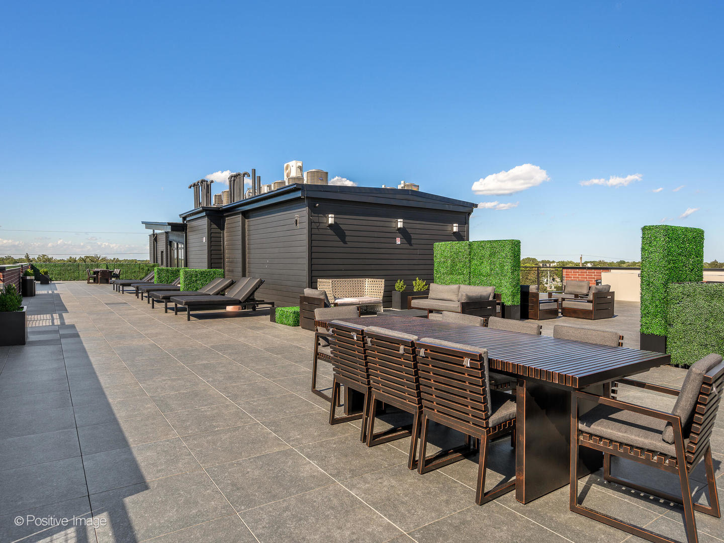 2801 Thatcher Avenue, Unit 303 River Grove, IL 60171 - Photo 30 of 33 a roof deck with table and chairs a barbeque