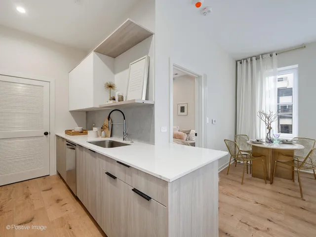a view of kitchen island sink with wooden floor