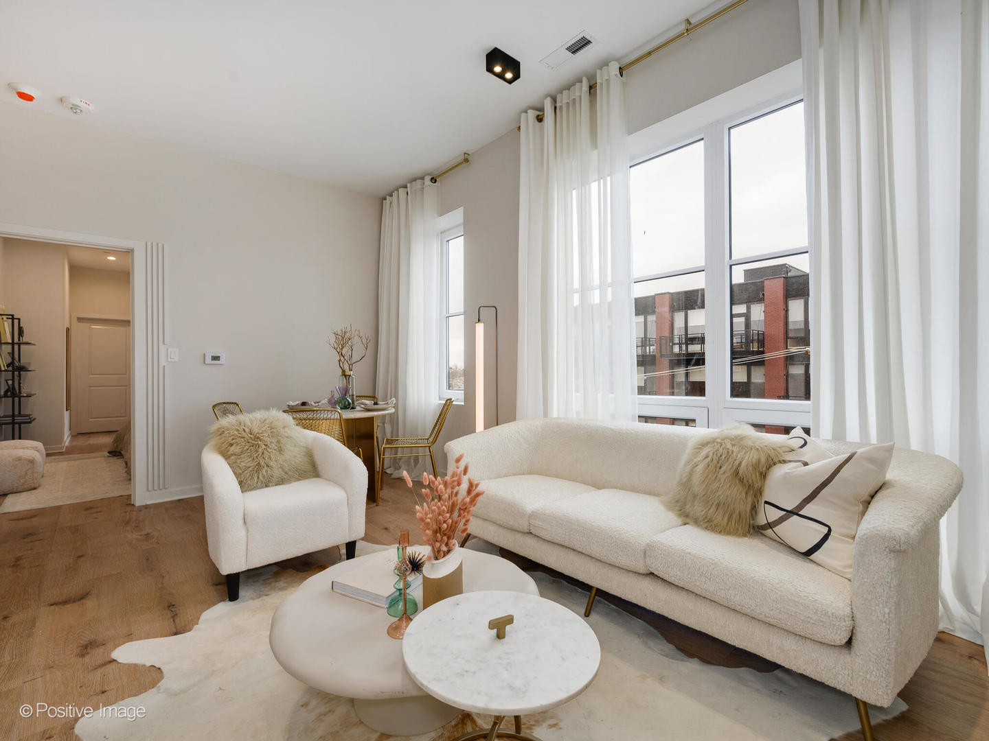 2801 Thatcher Avenue, Unit 303 River Grove, IL 60171 - Photo 8 of 33 a living room with furniture and a large window