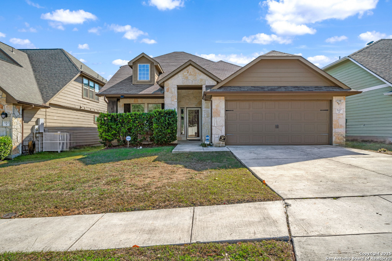 147 Brook View Cibolo, TX 78108 - Photo 1 of 29 a front view of a house with a yard