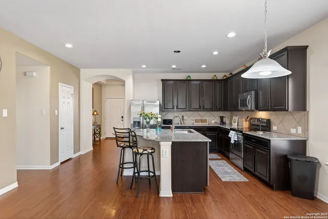 a kitchen with lots of counter top space and appliances