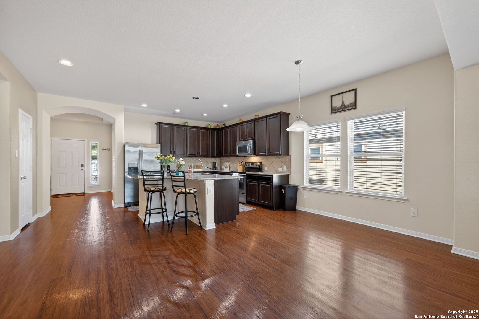 147 Brook View Cibolo, TX 78108 - Photo 14 of 29 a open kitchen with stainless steel appliances wooden floor and a refrigerator