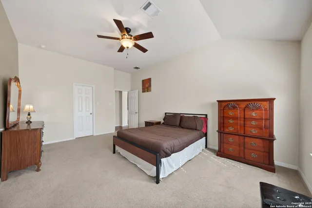 a living room with a bed and furniture