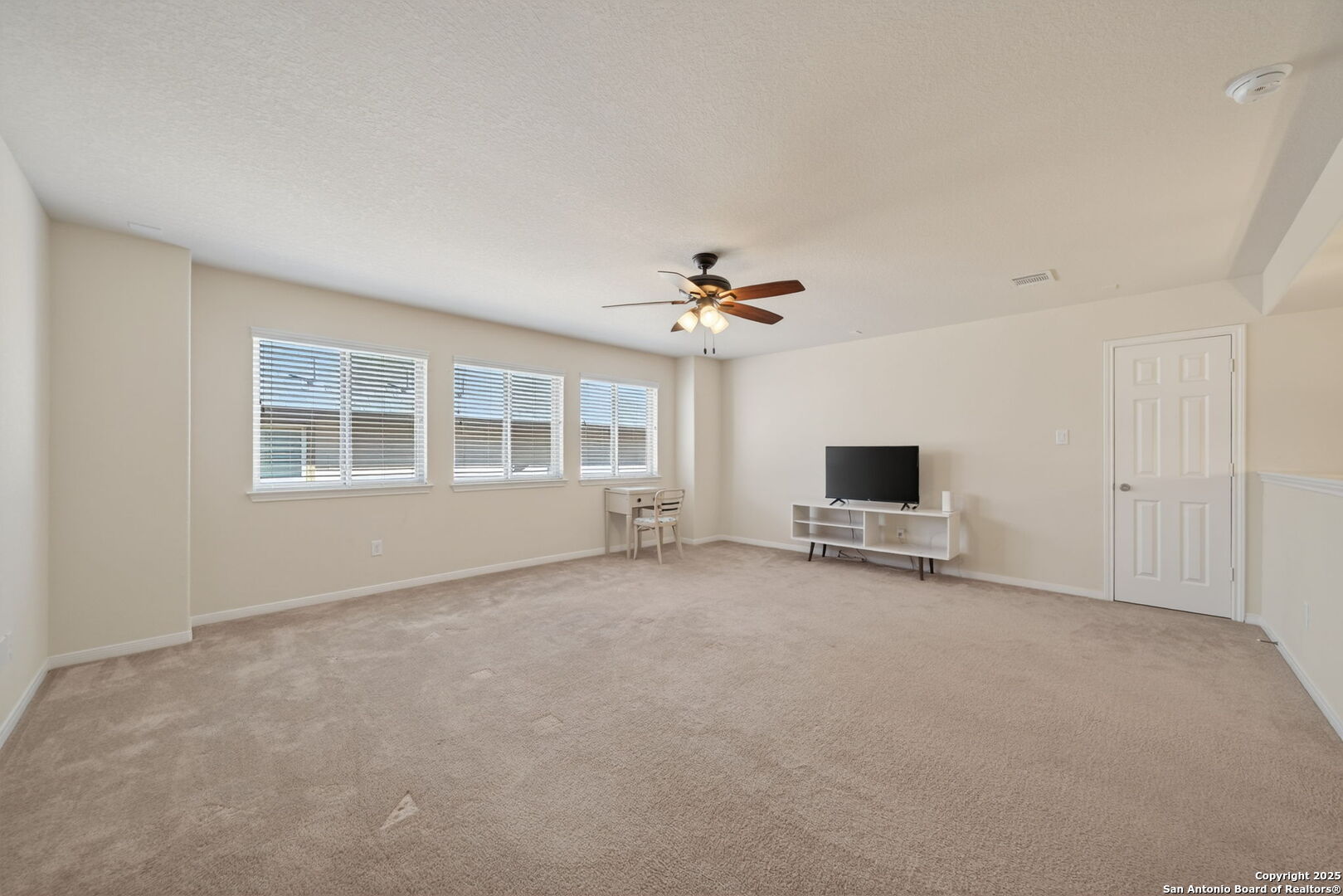 147 Brook View Cibolo, TX 78108 - Photo 24 of 29 a view of a livingroom with a flat screen tv
