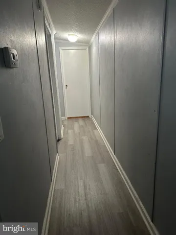 a view of hallway with an empty room