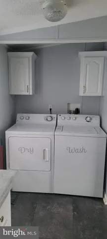 a utility room with washer and dryer
