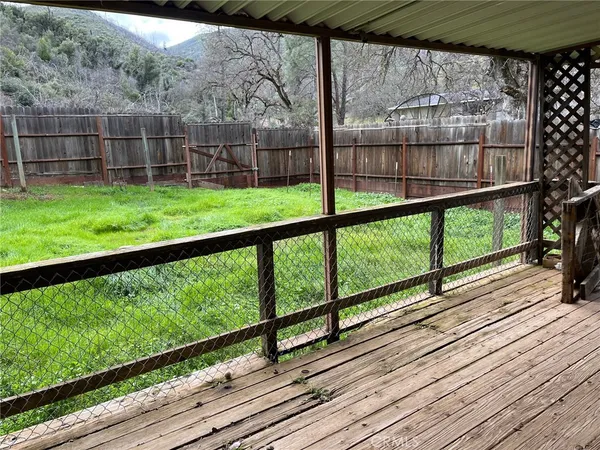 a view of balcony with wooden floor