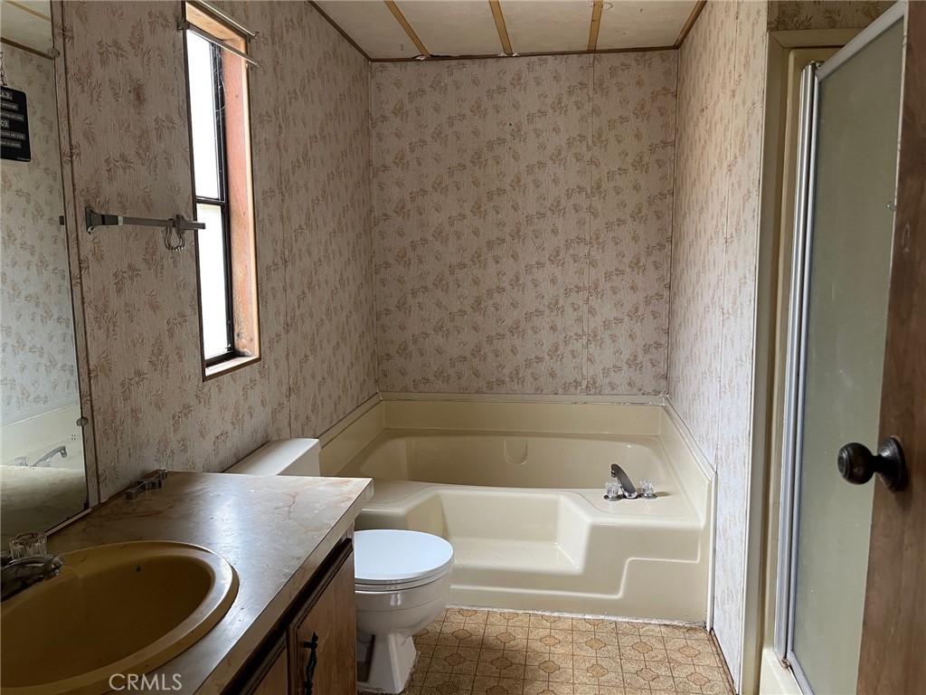 3701 Spring Valley Road Clearlake Oaks, CA 95423 - Photo 6 of 13 a bathroom with a sink toilet and shower