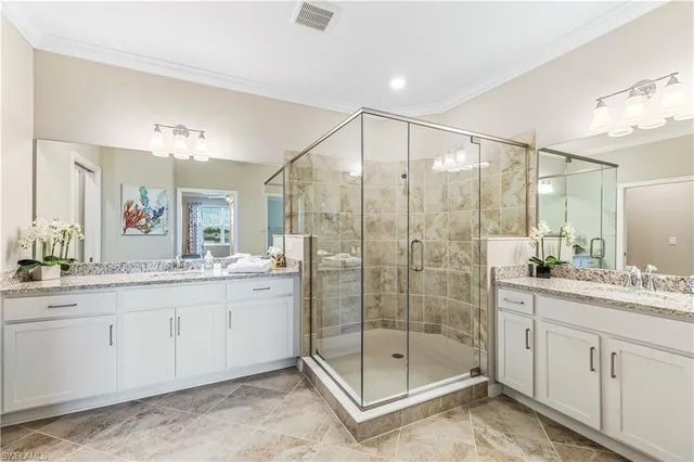 a bathroom with a shower sink and mirror
