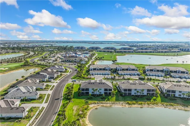 an aerial view of a house with a lake view