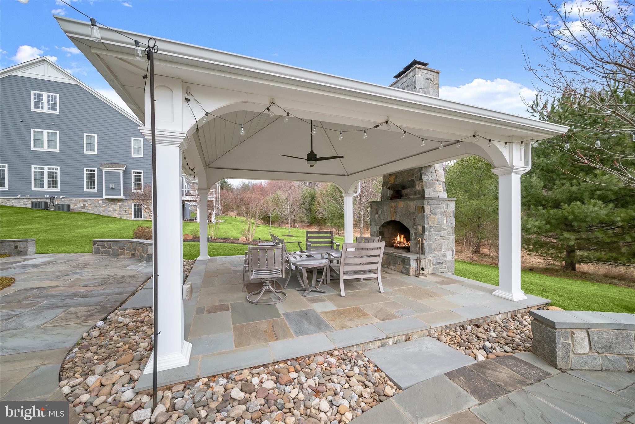 11810 Federal Street Fulton, MD 20759 - Photo 7 of 9 a view of a patio with a dining table chairs and a yard