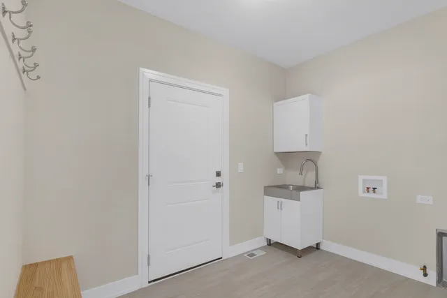 a room with cabinets and a wooden floor