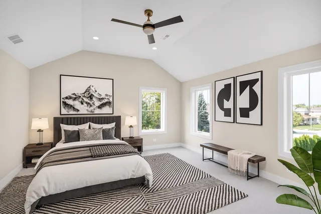 a bedroom with a large bed and a window