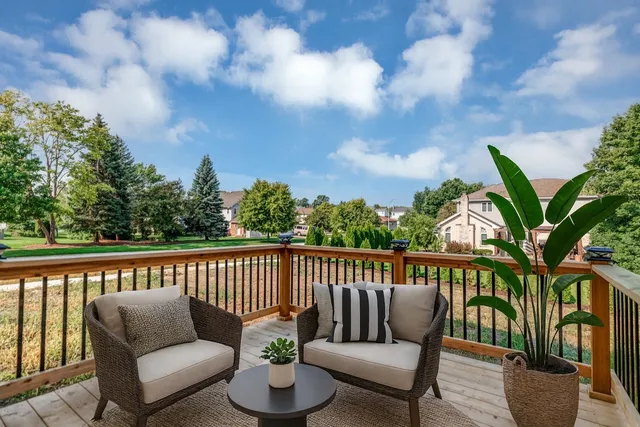 a view of balcony with wooden floor
