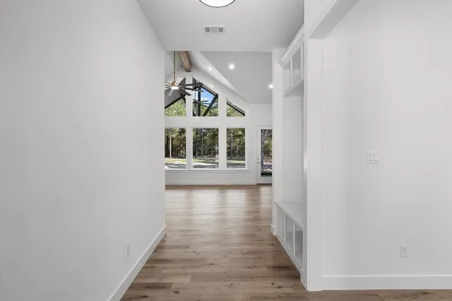 a view of a house with wooden floor and windows