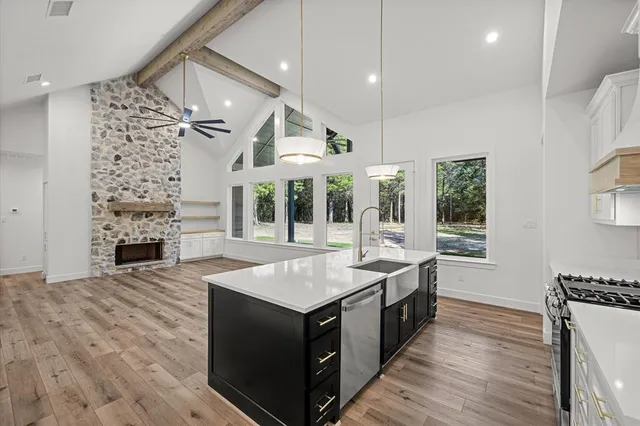 a kitchen with a stove and a sink