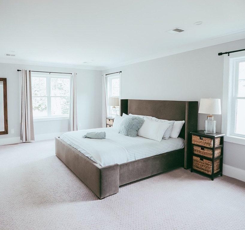 1 Proctor Street Natick, MA 01760 - Photo 13 of 23 a spacious bedroom with a bed and window