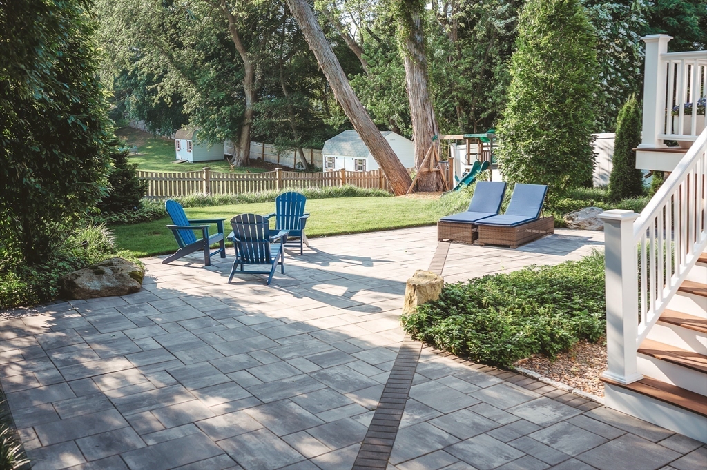 1 Proctor Street Natick, MA 01760 - Photo 22 of 23 a view of backyard with a table and chairs in patio