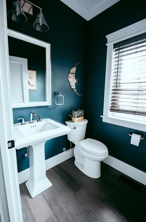 1 Proctor Street Natick, MA 01760 - Photo 8 of 23 a bathroom with a toilet a sink and a mirror
