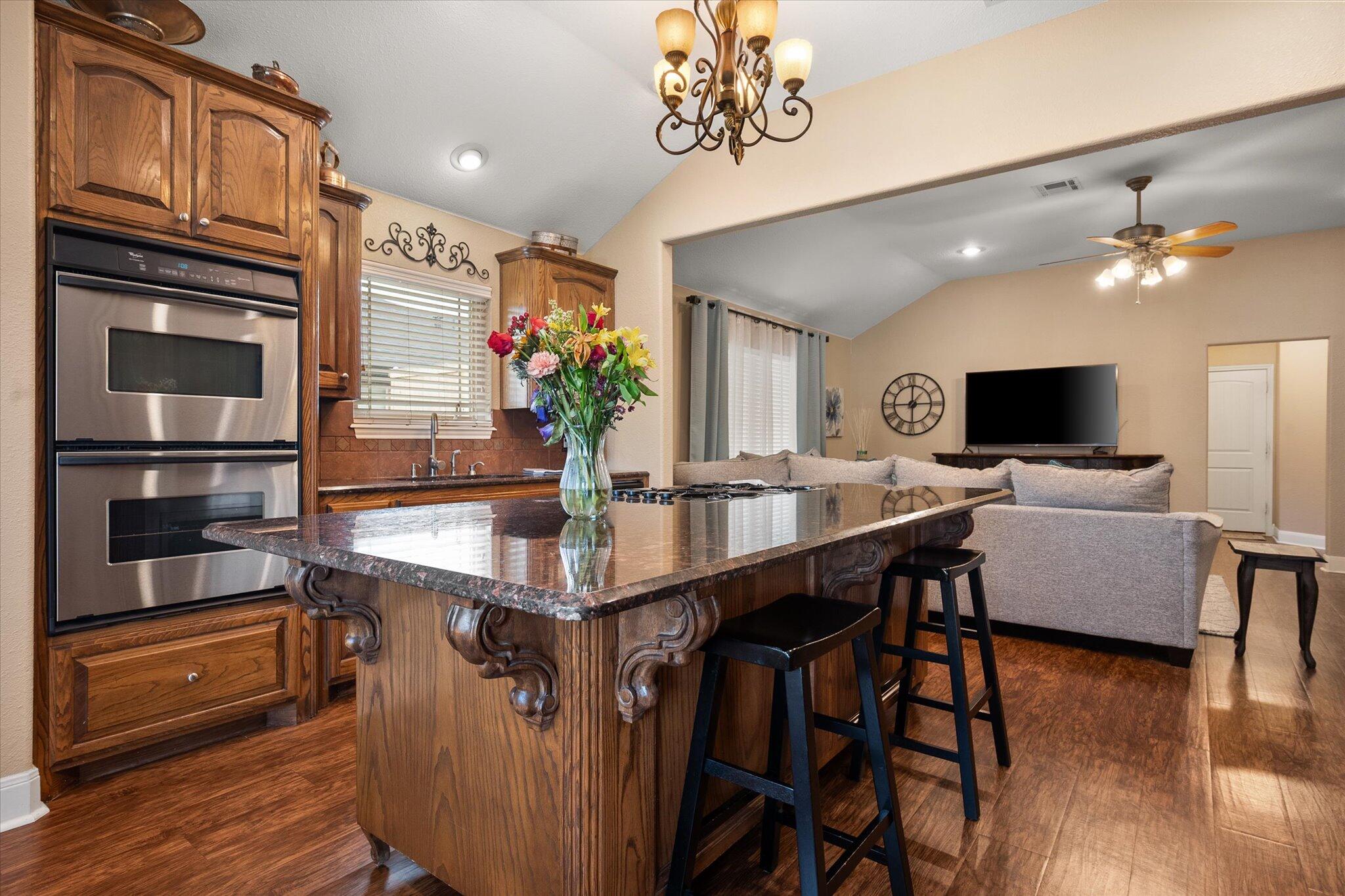 5908 110th Street Lubbock, TX 79424 - Photo 14 of 31 a view of a livingroom with furniture and a kitchen