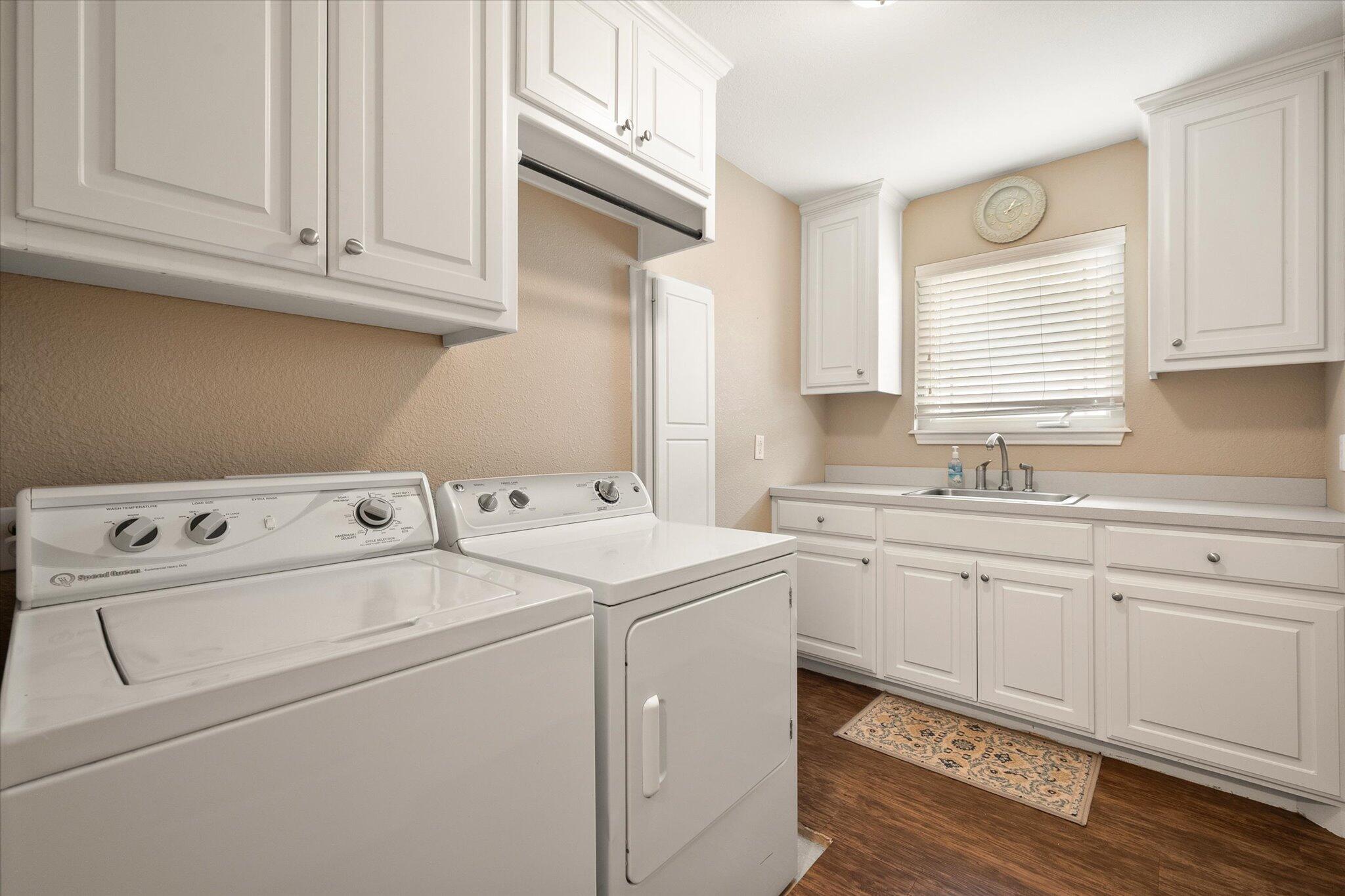 5908 110th Street Lubbock, TX 79424 - Photo 17 of 31 a utility room with dryer and washer