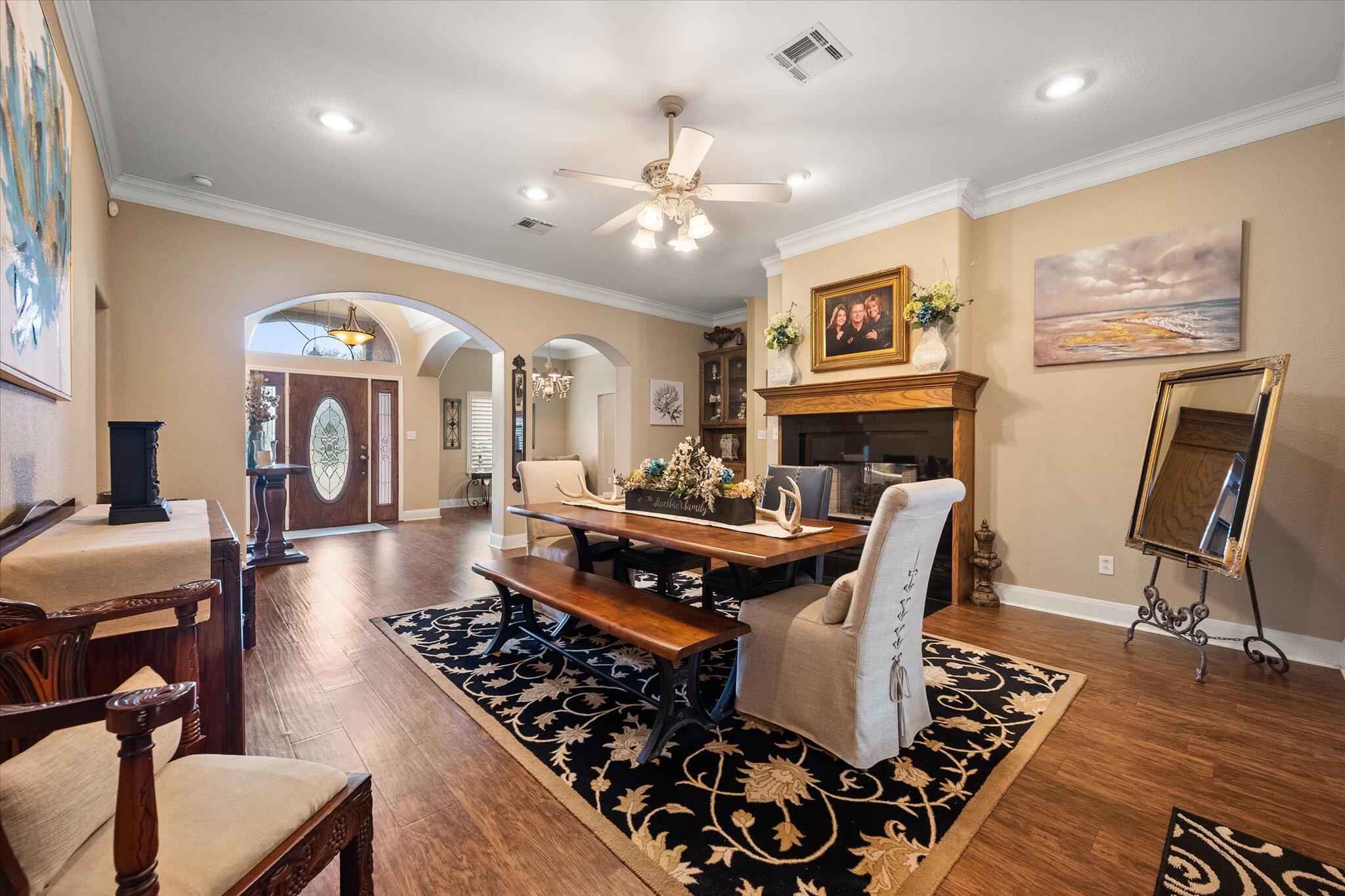 5908 110th Street Lubbock, TX 79424 - Photo 6 of 31 a living room with furniture and wooden floor
