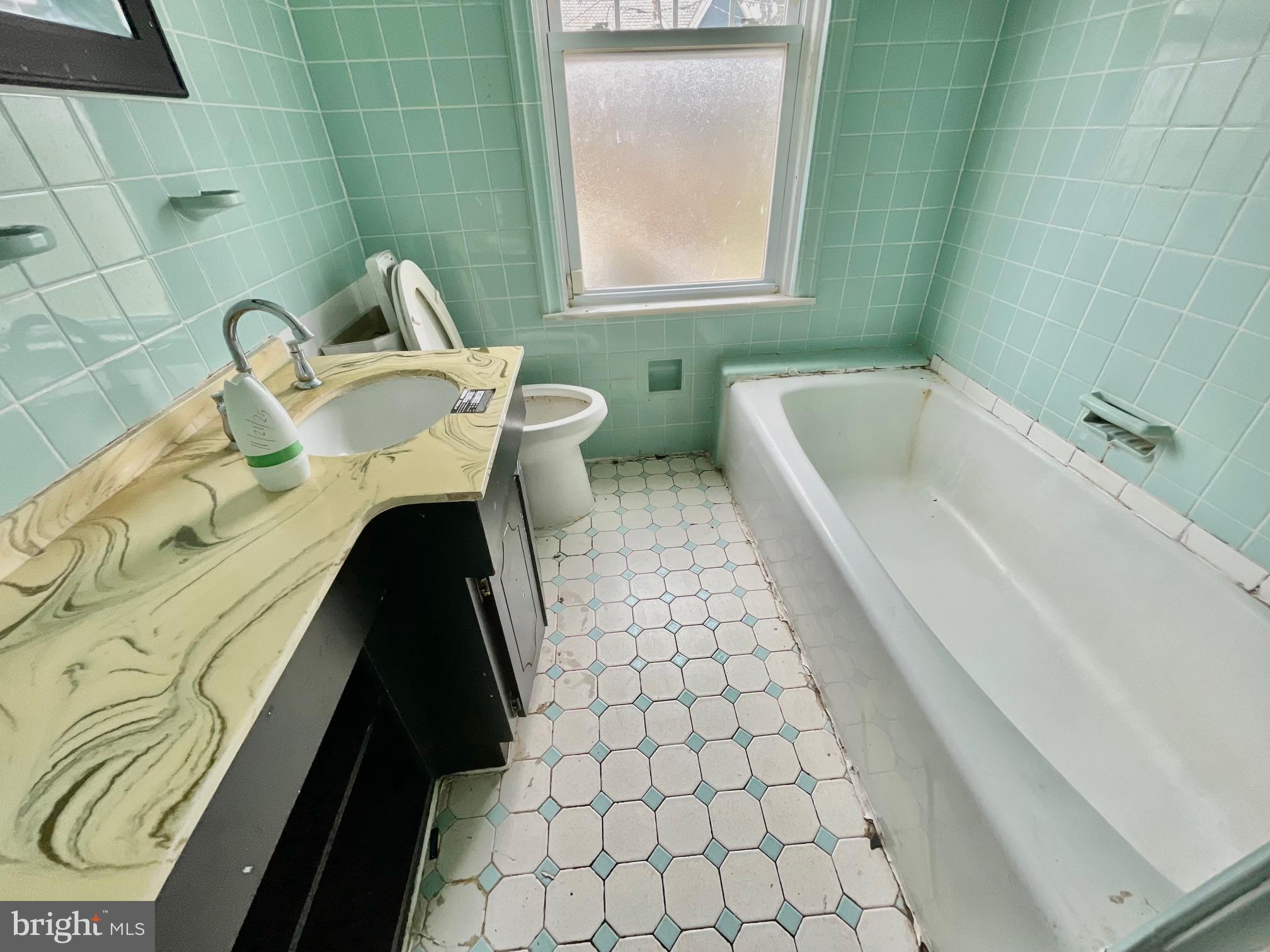 7723 Mill Road Elkins Park, PA 19027 - Photo 14 of 17 a bathroom with a sink toilet and bathtub