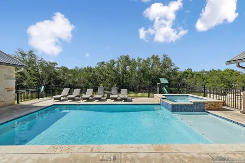 a view of a swimming pool with a patio