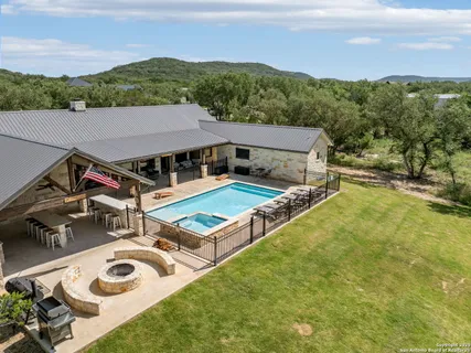 a view of a patio with swimming pool and mountain view