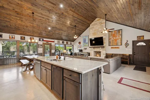 a kitchen with sink cabinets and outdoor space