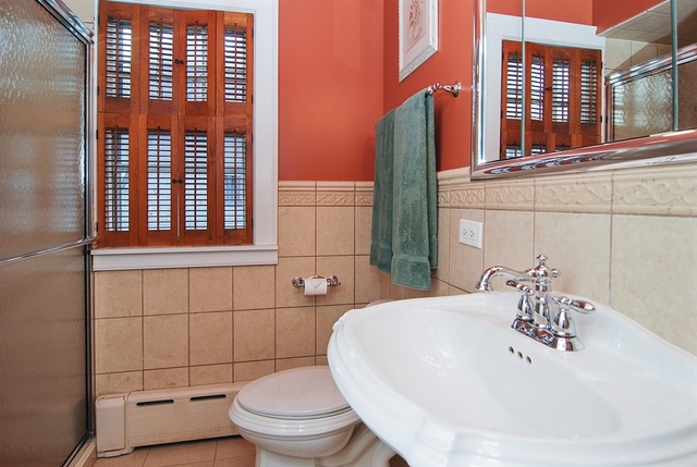 131 Lawton Road Riverside, IL 60546 - Photo 13 of 16 a bathroom with a sink a toilet and shower