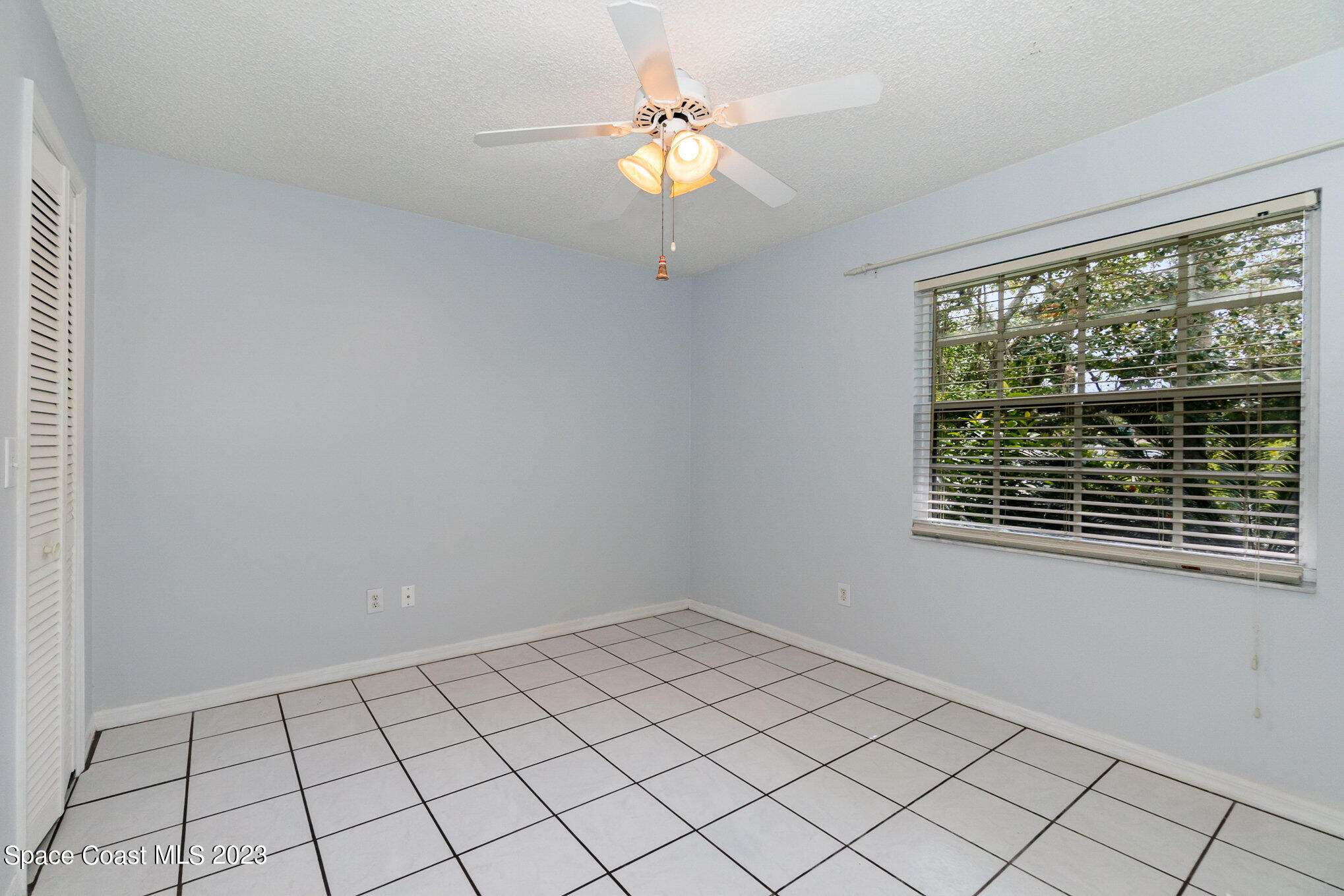 2399 Angel Road Palm Bay, FL 32909 - Photo 17 of 26 a view of an empty room with a window