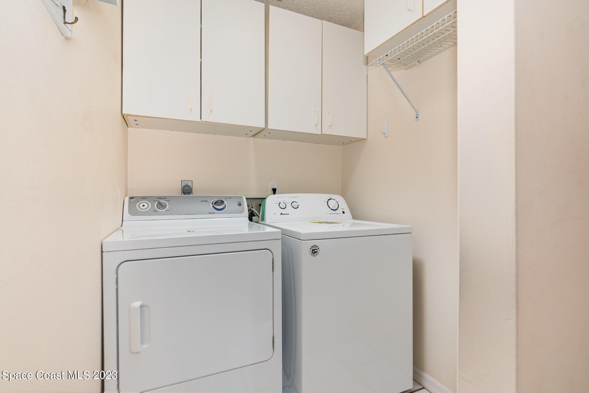 2399 Angel Road Palm Bay, FL 32909 - Photo 19 of 26 a utility room with dryer and washer