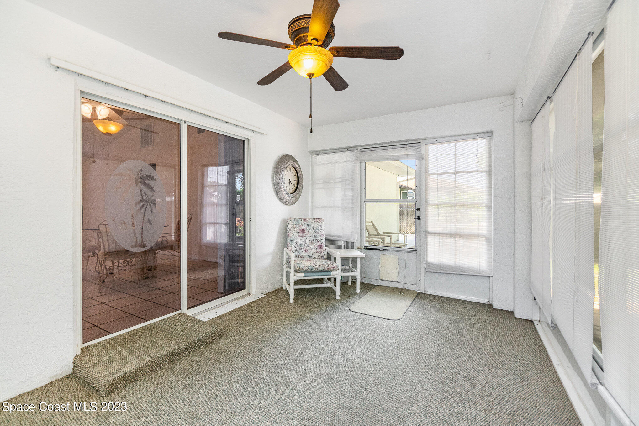 2399 Angel Road Palm Bay, FL 32909 - Photo 20 of 26 a living room with furniture and a chandelier