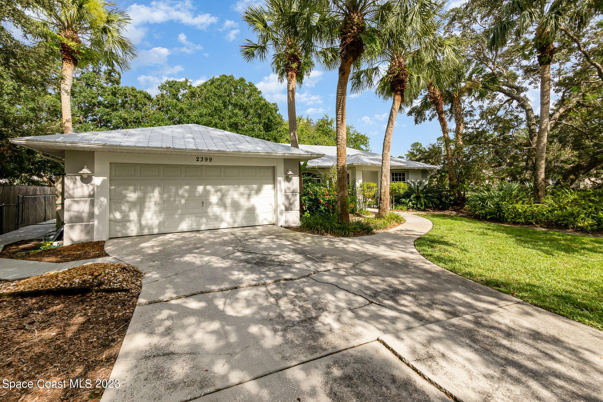 2399 Angel Road Palm Bay, FL 32909 - Photo 2 of 26 a view of a house with a yard