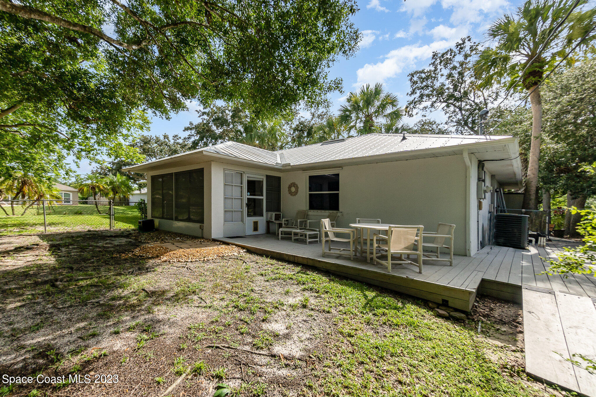2399 Angel Road Palm Bay, FL 32909 - Photo 23 of 26 a view of a house with backyard and sitting area