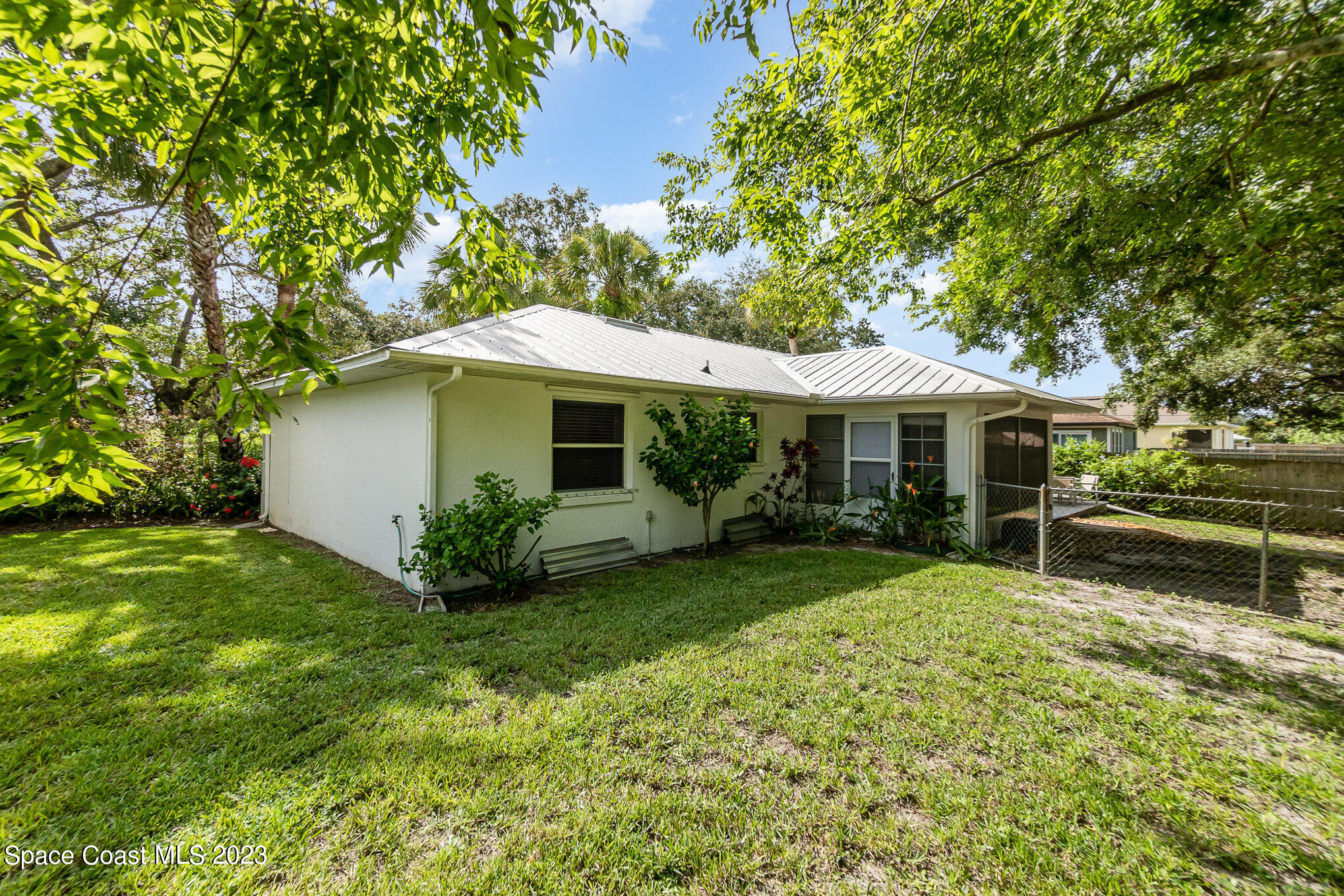 2399 Angel Road Palm Bay, FL 32909 - Photo 24 of 26 a front view of a house with garden