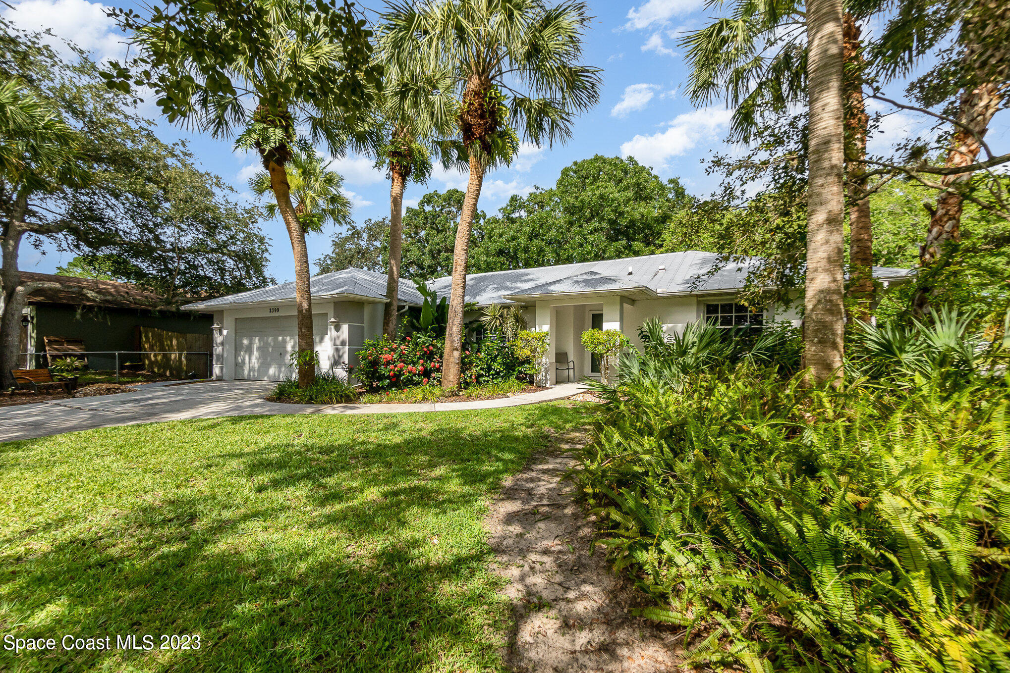 2399 Angel Road Palm Bay, FL 32909 - Photo 25 of 26 a view of a house with a yard and sitting area