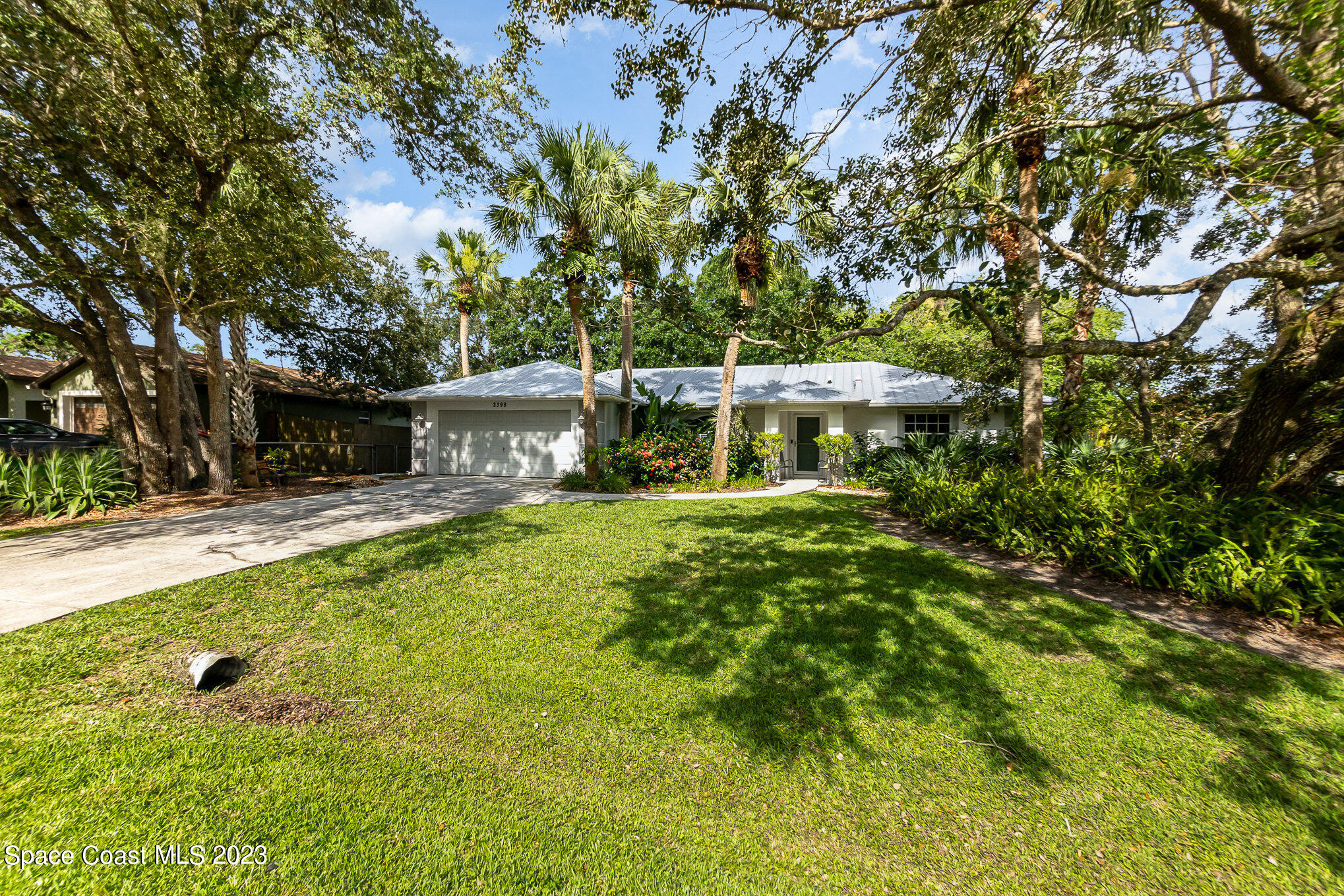2399 Angel Road Palm Bay, FL 32909 - Photo 26 of 26 a front view of a house with a yard